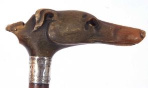 Partially ebonised mahogany walking cane with white metal ferrule, the horn handle formed as a