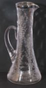 Antique glass jug of tapering cylindrical form, engraved with flowers etc, hallmarked silver rim