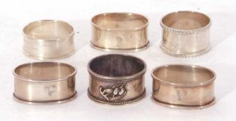 Mixed Lot: set of three plain oval napkin rings, Birmingham 1923 by F H Adams & Co, two further