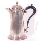 Silver hot water pot of tapering cylindrical form with a circular domed hinged lid with urn
