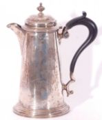 Silver hot water pot of tapering cylindrical form with a circular domed hinged lid with urn