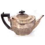 Victorian silver tea pot in traditional half fluted design in body and below the finial of the