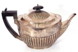 Victorian silver tea pot in traditional half fluted design in body and below the finial of the
