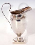 George V helmet cream jug in neo-classical style, having reeded rim and looped handle and with