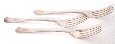 Group of three Georgian silver table forks, each engraved with an eagle crest and monogram,