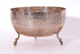 Late 19th century/early 20th century circular white metal bowl, the edge chased and embossed with