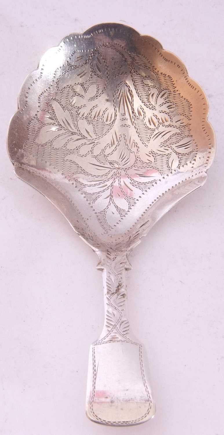 William IV silver Fiddle pattern caddy spoon, the bowl with engraved floral decoration and frilled