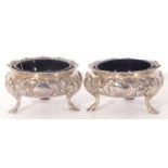 Pair of Victorian silver cauldron salts, having gadrooned rims and chased with flowers and scrolling