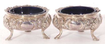 Pair of Victorian silver cauldron salts, having gadrooned rims and chased with flowers and scrolling
