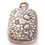 Antique spirit flask of typical form, one side heavily embossed with flowers and leaves etc, the