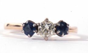 Diamond and sapphire three stone ring centring a round brilliant cut diamond, 0.25ct approx, multi-
