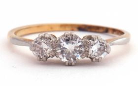 Three stone diamond ring featuring three round graduated brilliant cut diamonds, 0.30ct total