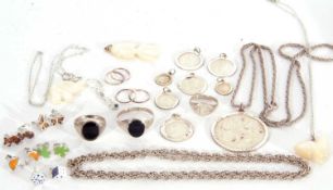 Mixed lot to include three white metal rings, a large white metal St Christopher and chain, seven