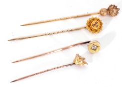 Group of four antique stick pins to include an unmarked old cut diamond set pin, a 15ct marked