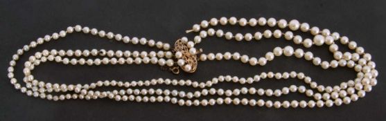 Cultured pearl necklace, a triple choker style row of graduated pearls (broken), to a 9ct sapphire