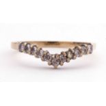 9ct gold and diamond wishbone design ring featuring eleven small single cut diamonds, size M