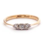 Small three stone diamond ring featuring three small round cut brilliant cut diamonds, total ct wt