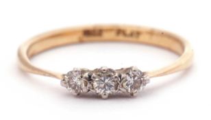 Small three stone diamond ring featuring three small round cut brilliant cut diamonds, total ct wt
