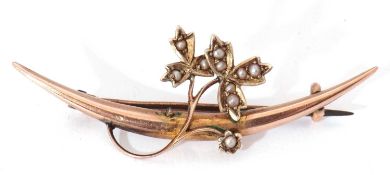 9ct gold and seed pearl brooch, plain polished curved bar applied with a scrolling leaf and vine