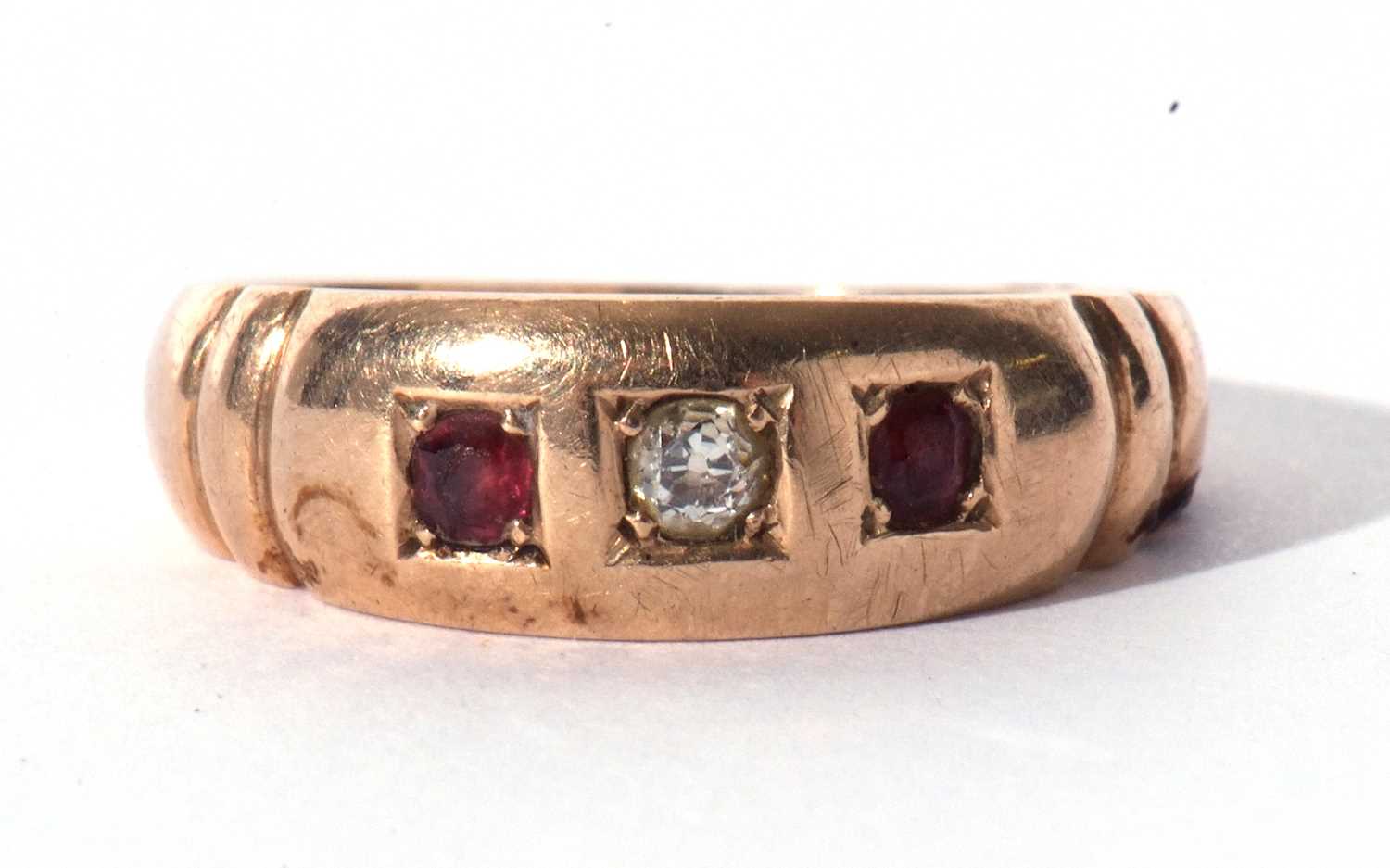 Diamond and ruby three stone ring centring an old cut diamond flanked by two round cut rubies, - Image 3 of 7