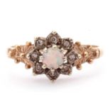 9ct gold opal and paste set cluster ring, the round cabochon opal raised above eight small pastes