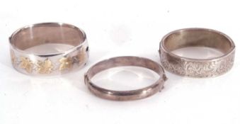 Mixed lot to include a hallmarked silver hinged bracelet, the top section applied and engraved