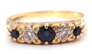 18ct gold sapphire and diamond ring featuring three round cut graduated sapphires and two small