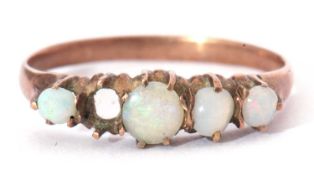 Four stone opal ring featuring four graduated round opal cabochons (one stone missing), all in an