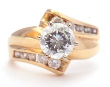 Modern 14k single cubic zirconia ring, the centre stone coronet set and raised above cubic