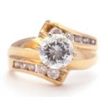 Modern 14k single cubic zirconia ring, the centre stone coronet set and raised above cubic