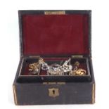Victorian leather jewel box and contents to include small quantity of costume brooches, pendants