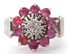 9ct white gold ruby and diamond cluster ring, the centre with a small diamond in illusion setting,