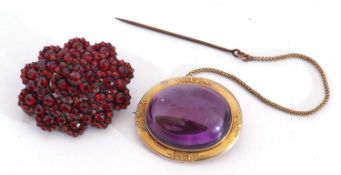 Antique Bohemian style locket brooch, the front set with red stone cluster, verso with a hinged