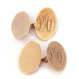 Pair of 9ct gold cuff links, oval panels, one panel engine turned decorated, the other with an