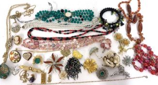 Large quantity of costume jewellery to include mainly brooches, necklaces, etc