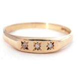 9ct gold three stone diamond ring featuring three small single cut diamonds, each in a star engraved