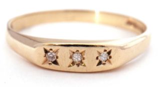 9ct gold three stone diamond ring featuring three small single cut diamonds, each in a star engraved