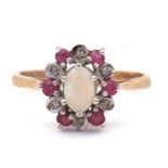 9ct gold opal, diamond and ruby set ring, the oval cabochon opal raised above a small ruby and