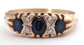 9ct gold sapphire and diamond seven stone ring featuring three graduated oval sapphires, highlighted