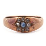 Antique sapphire and diamond ring, the central sapphire surrounded by eight small old cut