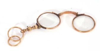 Antique folding pair of lorgnettes, circa 1910, with overlapping frames, engraved handle with a