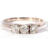 Three stone diamond ring featuring three round brilliant cut diamonds, 0.20ct each approx, raised in