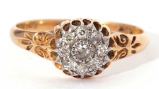 Diamond cluster ring, the principle diamond 0.05ct approx, surrounded by eight small old cut