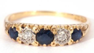 18ct gold sapphire and diamond five stone ring featuring three graduated round cut sapphires and two