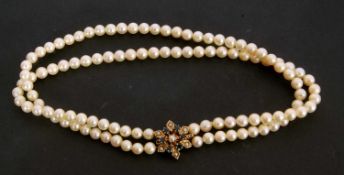 Double row cultured pearl choker style necklace of uniform size (6mm) to a 9ct gold sapphire and