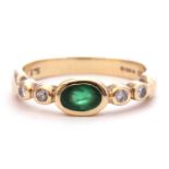 9ct gold, emerald and diamond ring, the centre oval emerald bezel set between small diamond set