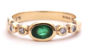 9ct gold, emerald and diamond ring, the centre oval emerald bezel set between small diamond set