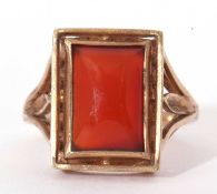 Carnelian set ring, the rectangular shaped carnelian panel framed between pierced shoulders, stamped