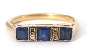 Art Deco sapphire and diamond ring, line set with three square calibre cut sapphires, highlighted