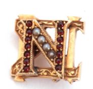 Small yellow metal seed pearl and garnet letter 'N' brooch, engraved verso G W Hall, 14 x 12mm